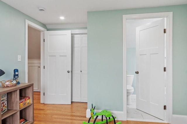 interior space with recessed lighting, light wood-style flooring, and baseboards