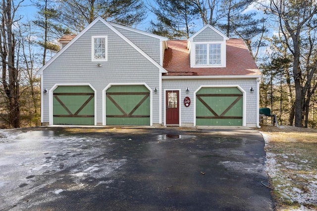 cape cod house with a garage