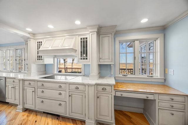 kitchen with premium range hood, stainless steel dishwasher, light stone counters, light hardwood / wood-style floors, and black electric cooktop