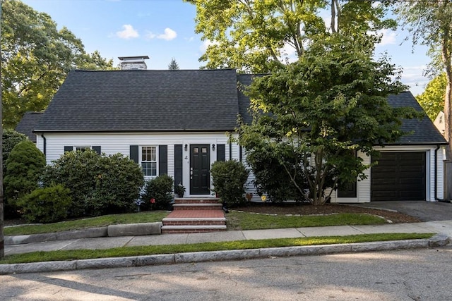 cape cod house with a garage