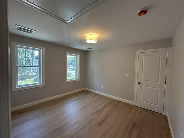 6 Knott St, Attleboro, MA 02703 - empty room featuring light wood-type flooring and attic access
