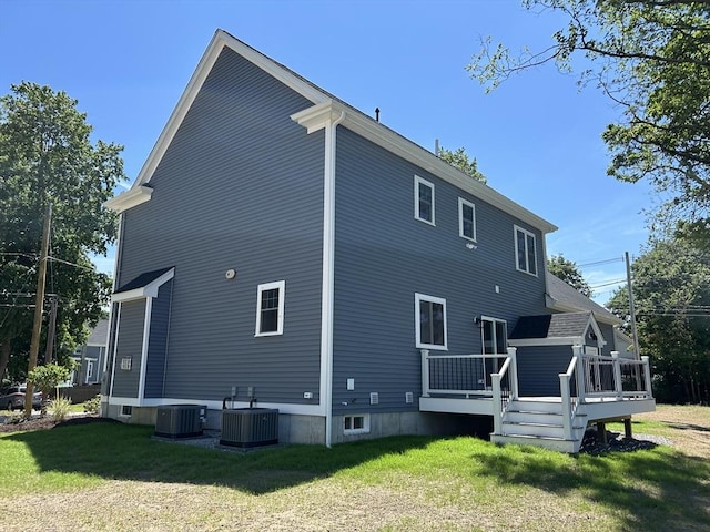 6 Knott St, Attleboro, MA 02703 - back of property with a yard and a wooden deck