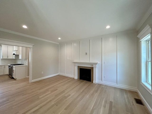 6 Knott St, Attleboro, MA 02703 - unfurnished living room with a fireplace, crown molding, light wood finished floors, and recessed lighting