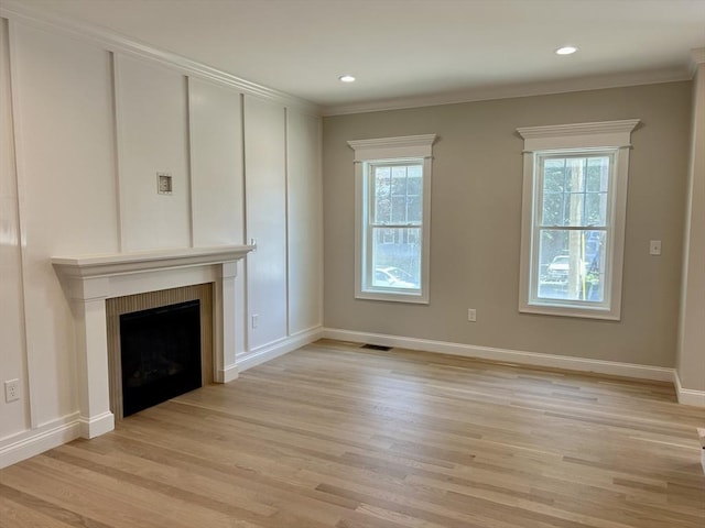 6 Knott St, Attleboro, MA 02703 - unfurnished living room with healthy amount of natural light, light wood-style floors, a fireplace, crown molding, and recessed lighting