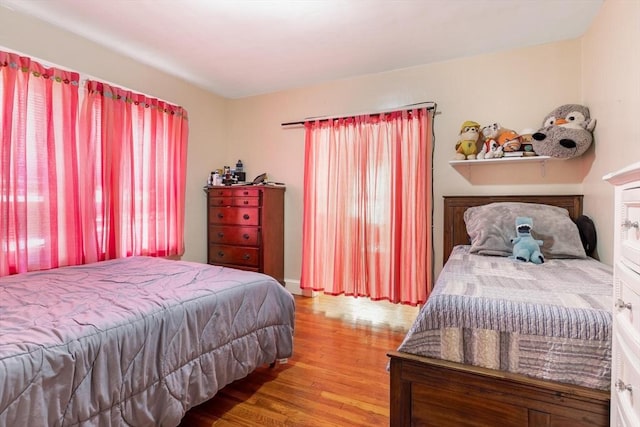 bedroom with wood finished floors