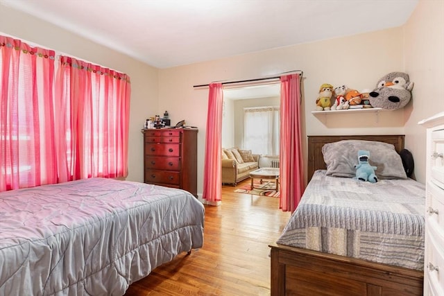 bedroom with wood finished floors