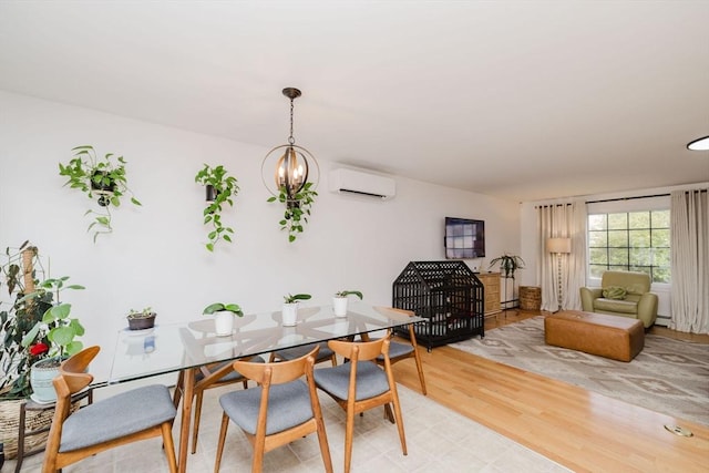 85 Evelyns Way, Fall River, MA 02724 - dining space with an AC wall unit, light wood-style flooring, and a chandelier
