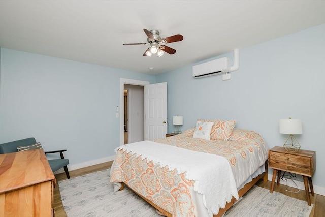 85 Evelyns Way, Fall River, MA 02724 - bedroom with a wall mounted air conditioner, wood finished floors, and a ceiling fan