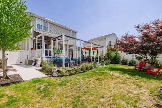 85 Evelyns Way, Fall River, MA 02724 - rear view of house featuring a fenced backyard and a patio