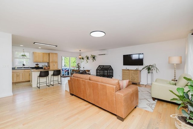 85 Evelyns Way, Fall River, MA 02724 - living room with light wood-type flooring and an AC wall unit