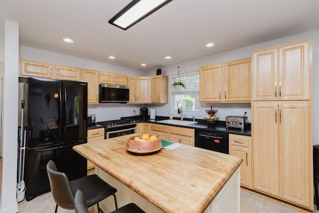 85 Evelyns Way, Fall River, MA 02724 - kitchen with black appliances, light brown cabinets, recessed lighting, light tile patterned floors, and dark countertops