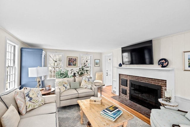 living room featuring a fireplace and wood finished floors