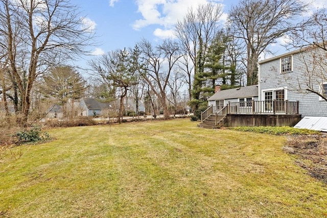 view of yard featuring a wooden deck