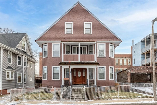 view of front of property featuring a balcony