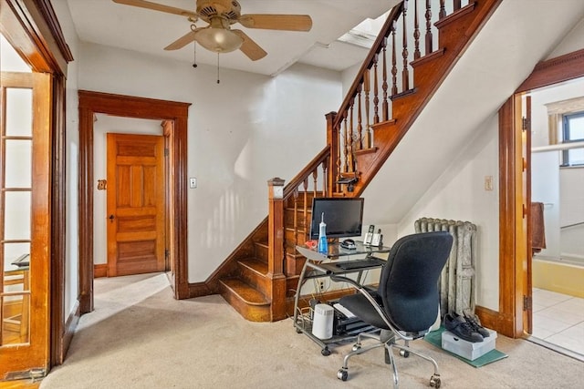 office space featuring ceiling fan and light colored carpet