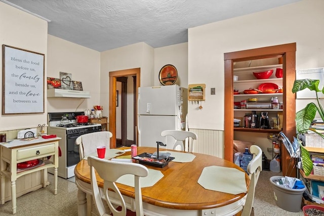 dining room with a textured ceiling