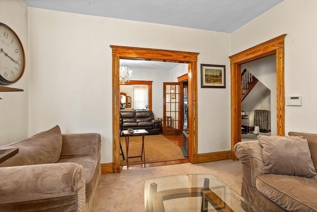 carpeted living room featuring french doors