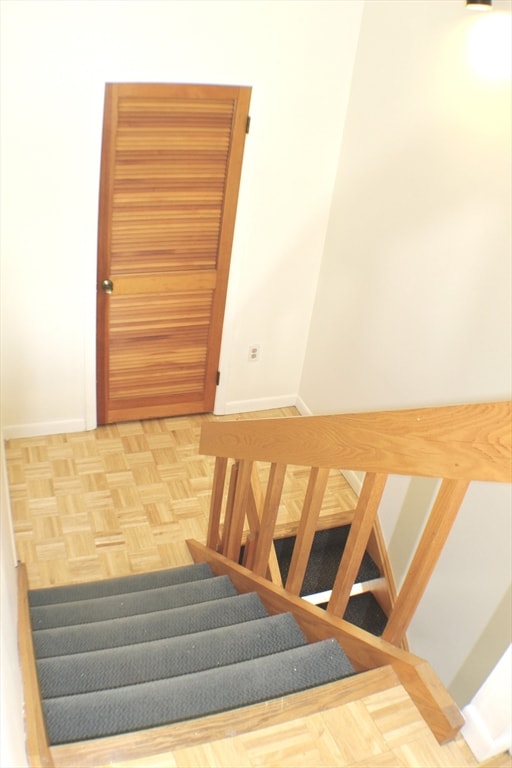 stairway featuring baseboards