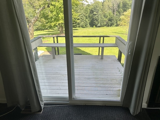 doorway with dark carpet