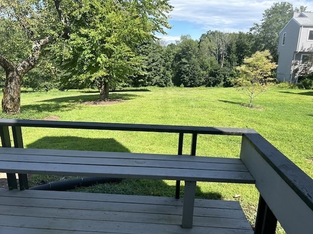 exterior space with a yard and a wooden deck