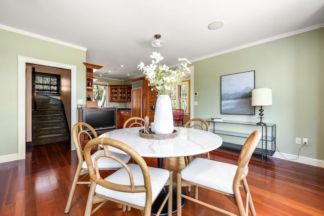 dining area with dark wood-style floors, baseboards, stairway, and crown molding