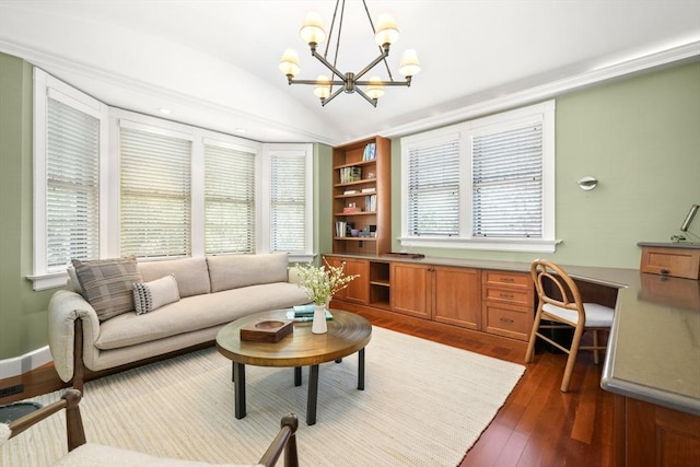 living room featuring dark wood-style floors, plenty of natural light, lofted ceiling, and built in study area