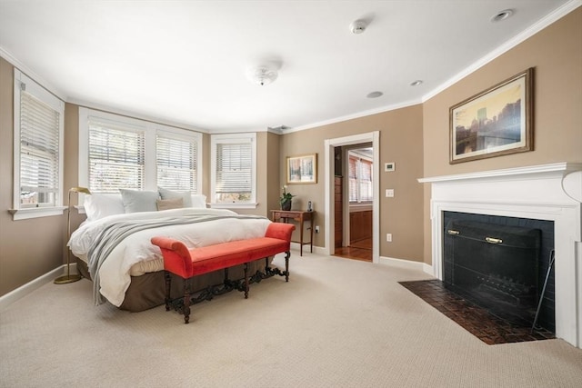 carpeted bedroom with a fireplace with flush hearth, multiple windows, crown molding, and baseboards