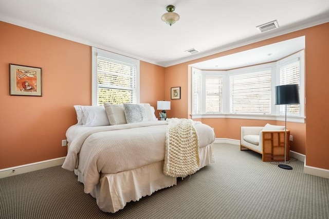 bedroom with carpet flooring, visible vents, and baseboards