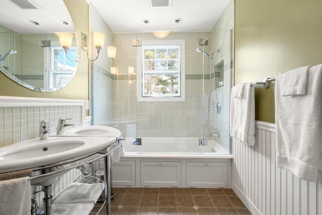 bathroom with wainscoting, visible vents, shower / bathing tub combination, and tile patterned floors