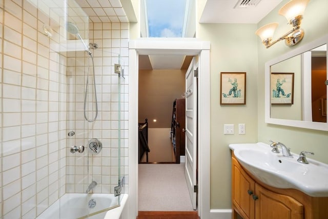 bathroom featuring visible vents, shower / washtub combination, and vanity