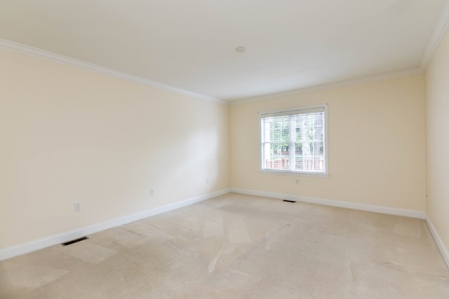 carpeted spare room with ornamental molding