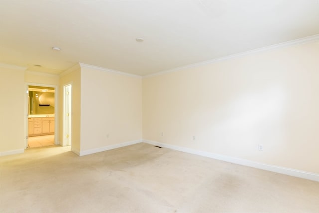 carpeted empty room featuring ornamental molding