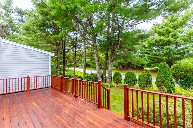 deck featuring a lawn