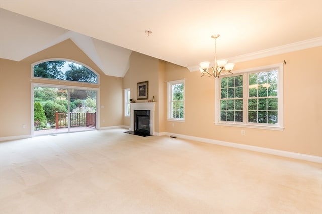 unfurnished living room with light carpet, crown molding, high vaulted ceiling, and an inviting chandelier