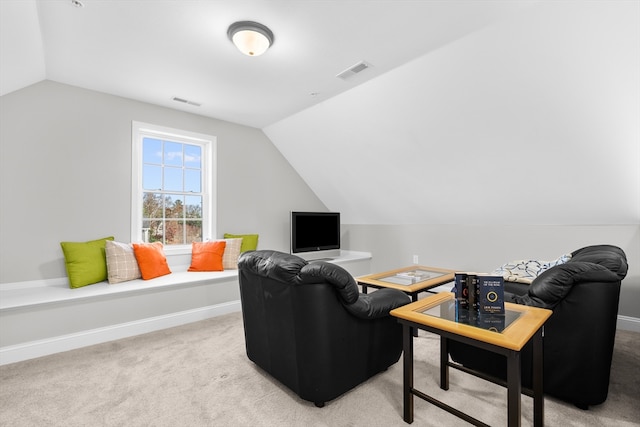 living room with lofted ceiling and carpet floors