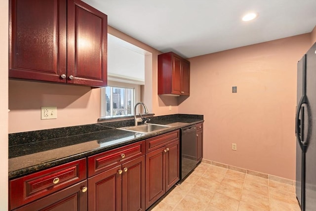 1 Nassau St Unit 2105, Boston, MA 02111 - kitchen with baseboards, dark stone countertops, black appliances, a sink, and reddish brown cabinets