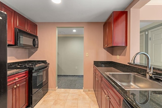1 Nassau St Unit 2105, Boston, MA 02111 - kitchen with baseboards, a sink, black appliances, and reddish brown cabinets