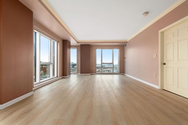 1 Nassau St Unit 2105, Boston, MA 02111 - spare room with light wood-type flooring, baseboards, and ornamental molding