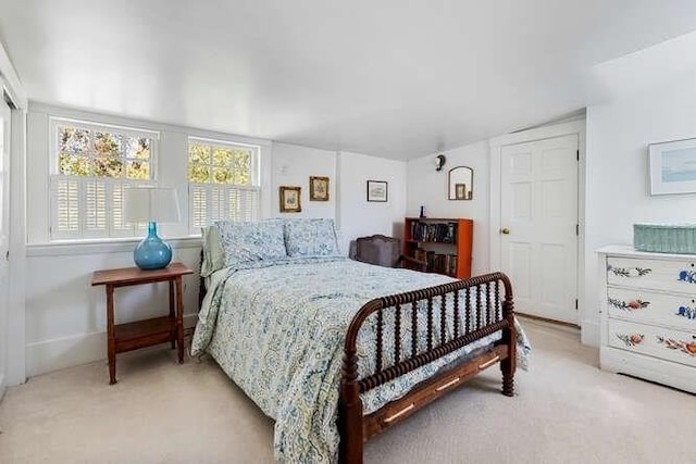 bedroom with light colored carpet