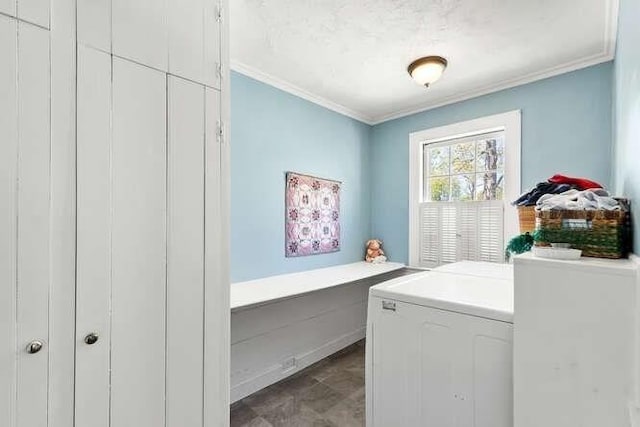 laundry room featuring separate washer and dryer and ornamental molding