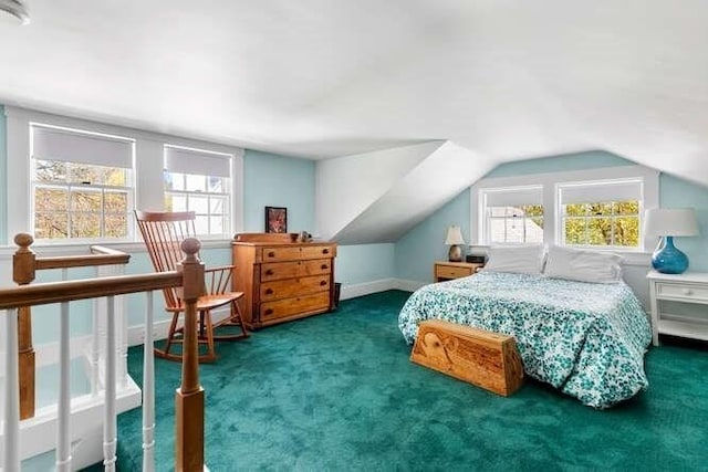 carpeted bedroom featuring lofted ceiling