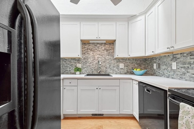 51 Nottingham Rd Unit 51, Grafton, MA 01519 - kitchen with black appliances, light wood-style floors, light countertops, and tasteful backsplash