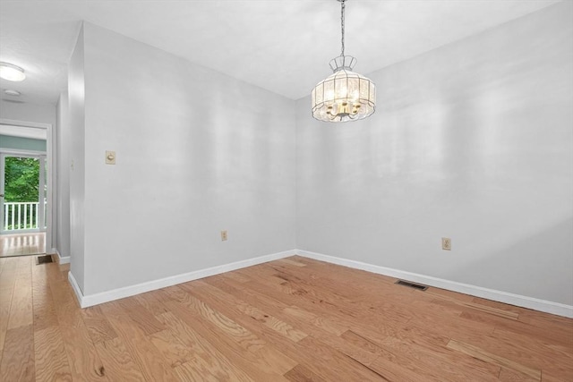 51 Nottingham Rd Unit 51, Grafton, MA 01519 - spare room featuring light wood finished floors and a chandelier