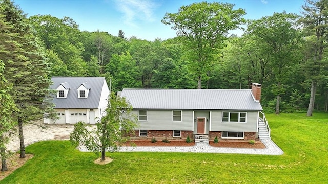 531 Old N Rd, Worthington, MA 01098 - split foyer home with a view of trees, a front yard, a chimney, and entry steps