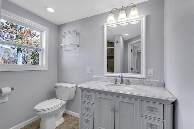 531 Old N Rd, Worthington, MA 01098 - full bath with baseboards, vanity, toilet, and a shower