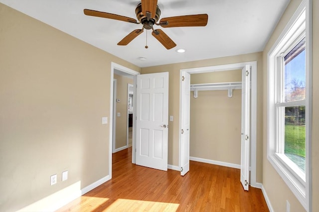 531 Old N Rd, Worthington, MA 01098 - unfurnished bedroom featuring multiple windows, light wood-style floors, baseboards, a closet, and recessed lighting