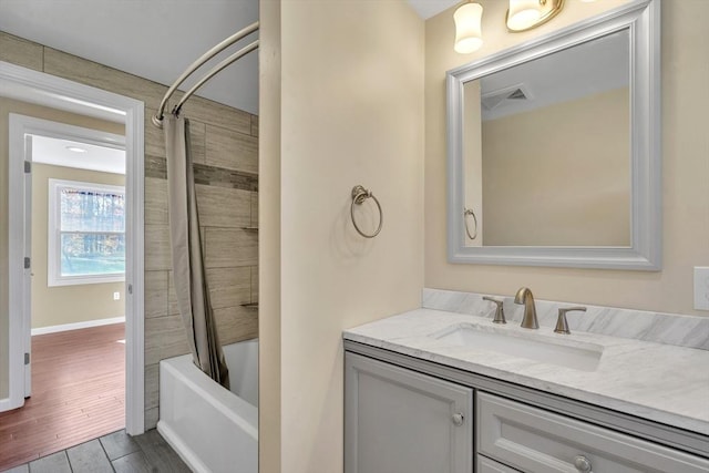 531 Old N Rd, Worthington, MA 01098 - full bath featuring vanity, shower / tub combo with curtain, wood finished floors, and baseboards