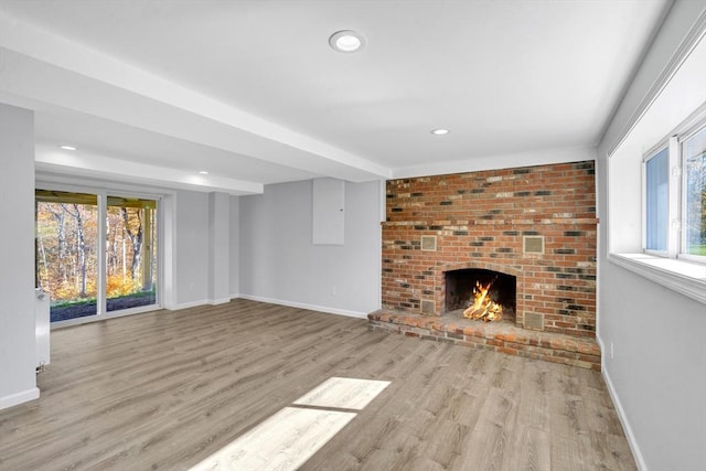 531 Old N Rd, Worthington, MA 01098 - unfurnished living room featuring baseboards, wood finished floors, a fireplace, and recessed lighting