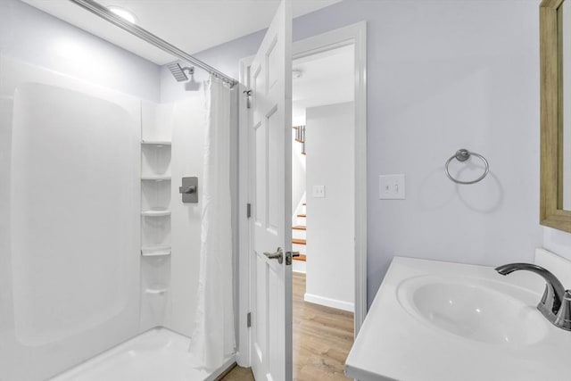 531 Old N Rd, Worthington, MA 01098 - bathroom featuring a shower with shower curtain, wood finished floors, vanity, and baseboards