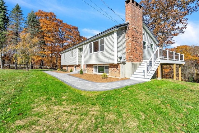 531 Old N Rd, Worthington, MA 01098 - view of home's exterior with stairs, a chimney, a lawn, and a deck